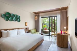 Ein Bett oder Betten in einem Zimmer der Unterkunft Dusit Princess Moonrise Beach Resort