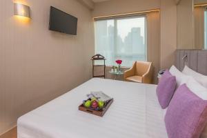 Postel nebo postele na pokoji v ubytování Silka Far East Hotel
