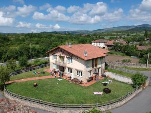 an aerial view of a large house on a grass field at Casa Rural Quopiki in Gopegi