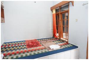 Ein Bett oder Betten in einem Zimmer der Unterkunft Budi House & Food Station
