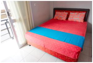 Ein Bett oder Betten in einem Zimmer der Unterkunft Budi House & Food Station