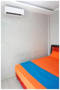 Ein Bett oder Betten in einem Zimmer der Unterkunft Budi House & Food Station