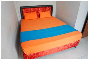 Ein Bett oder Betten in einem Zimmer der Unterkunft Budi House & Food Station