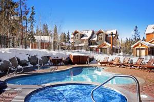 a swimming pool in a yard with chairs and a house at 6506 Settlers Creek Condo in Keystone