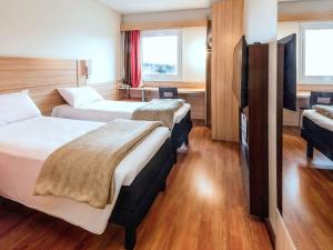 Letto o letti in una camera di ibis Concepcion