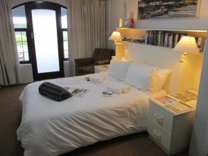 En eller flere senger på et rom på Casa Del Mar
