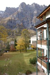 a house with a view of a mountain at Appartementhaus La Promenade in Leukerbad