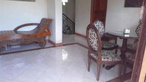 Posezení v ubytování The Reinhold Guesthouse Bali