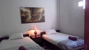 Postel nebo postele na pokoji v ubytování The Reinhold Guesthouse Bali