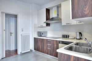 A kitchen or kitchenette at Athens Glyfada Riviera Apartment