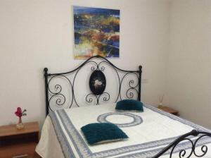a bed with two pillows on it in a bedroom at Villa Giulia in Avezzano