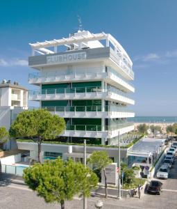 a building with a bulovo sign on it at Club House Hotel in Rimini