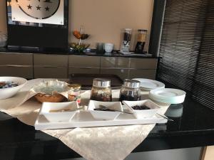 a table with a tray of food on a counter at Hotel Nais Beach in Durrës +46 photos