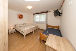 Postel nebo postele na pokoji v ubytování Rooms Ivan