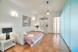 A television and/or entertainment centre at Athens Glyfada Riviera Apartment