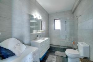 A bathroom at Athens Glyfada Riviera Apartment