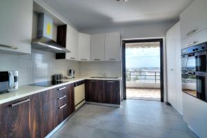 A kitchen or kitchenette at Athens Glyfada Riviera Apartment