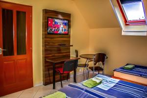 En eller flere senge i et værelse på Nexus Vendégház Szeged