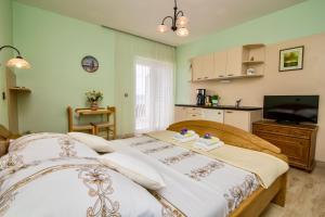 Postel nebo postele na pokoji v ubytování Pansion Adria