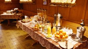 a table with a bunch of fruit on it at Hotel Paulanerstuben in Wasserburg am Inn