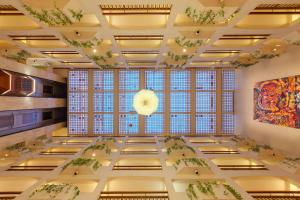 a large room with a large window in a building at St Raphael Resort in Limassol