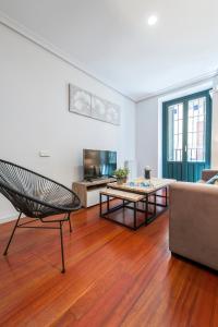 a living room with a couch and a table at Plaza España in Madrid