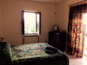 Ένα ή περισσότερα κρεβάτια σε δωμάτιο στο Le Terre D'Abruzzo