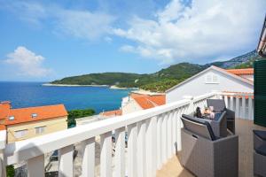 a balcony with a view of the ocean at Sea View Luxury Apartments, ALA DA in Milna