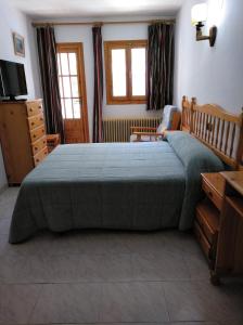 Llit o llits en una habitació de Pensión Rural Arroyo la Teja