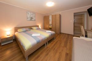 Postel nebo postele na pokoji v ubytování Rooms Ivan