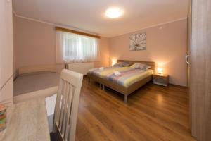 Postel nebo postele na pokoji v ubytování Rooms Ivan