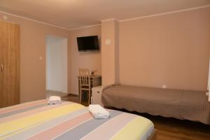 Postel nebo postele na pokoji v ubytování Rooms Ivan