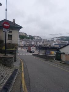 a street with a stop sign on the side of a road at Apartamentos turísticos Vistademar in Luarca