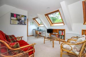 a living room with a couch and a table at Stay at Penny's Mill in Frome