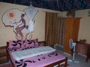 
A bed or beds in a room at Les Calaos du Saloum
