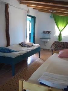 Säng eller sängar i ett rum på Danube Delta Hostel Homestay & Camping