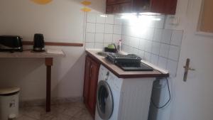 Kuchyň nebo kuchyňský kout v ubytování All-Inn