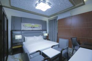 Кровать или кровати в номере Niyaf Hotel Appartments