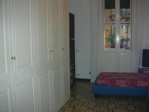 a room with a bedroom with a bed and a door at La Risorgente B&B in Rome