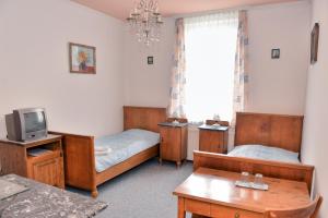 Voodi või voodid majutusasutuse Pension Josef toas