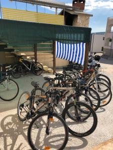 a group of bikes parked next to a building at Apartments Barisic Hrvatskih Žrtava 404 Seget Vranjica in Trogir