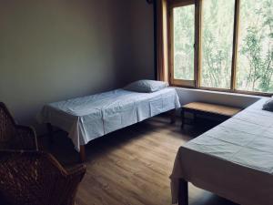Ein Bett oder Betten in einem Zimmer der Unterkunft PONYO stays