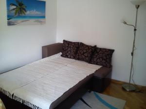 Postel nebo postele na pokoji v ubytování Apartmani Luja