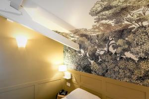Ein Bett oder Betten in einem Zimmer der Unterkunft Passy Eiffel