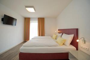 Postel nebo postele na pokoji v ubytování Pension Appartement Lanzer