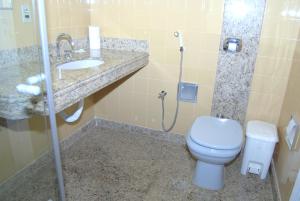 a bathroom with a toilet and a sink at Hotel Tijuco Turismo in Diamantina +51 photos