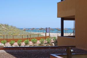 a view of the beach from a building at Apartaments Beach & Golf Resort in Pals