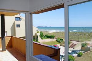 a view of the ocean from the balcony of a house at Apartaments Beach & Golf Resort in Pals