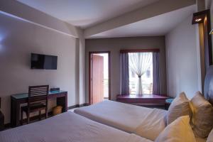 Postel nebo postele na pokoji v ubytování Lombok Garden Hotel