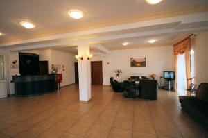 a large living room with a couch and a table at Sunset in Karwia